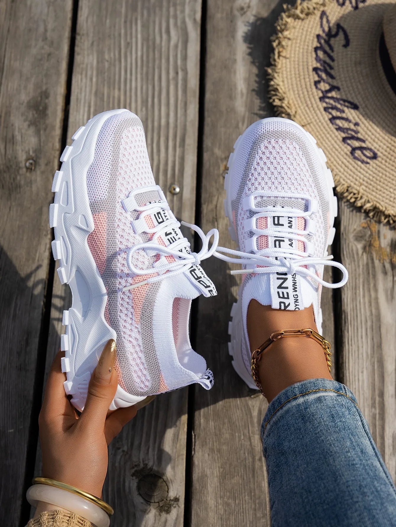 Women's Flyknit mesh lace-up sneakers in multiple colours on a rubber sole.