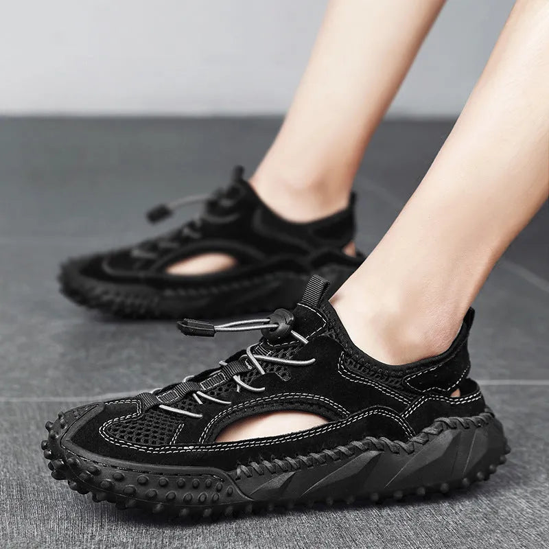 Men's black sports sandal with leather mesh upper, elastic band, and textured rubber sole.