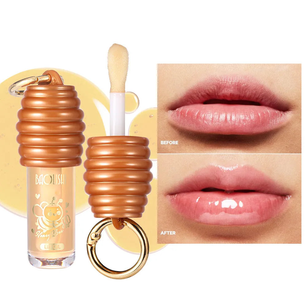 Honey Lip Gloss in a portable keychain case for moisturising and nourishing lips.