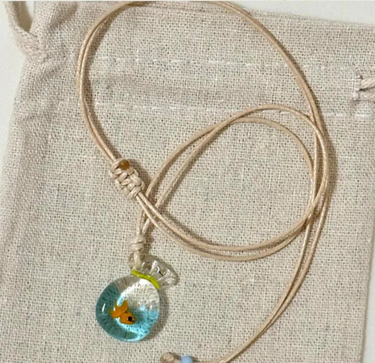 Women's pendant necklace with coloured glaze skirt joker charm on cotton linen clavicle chain