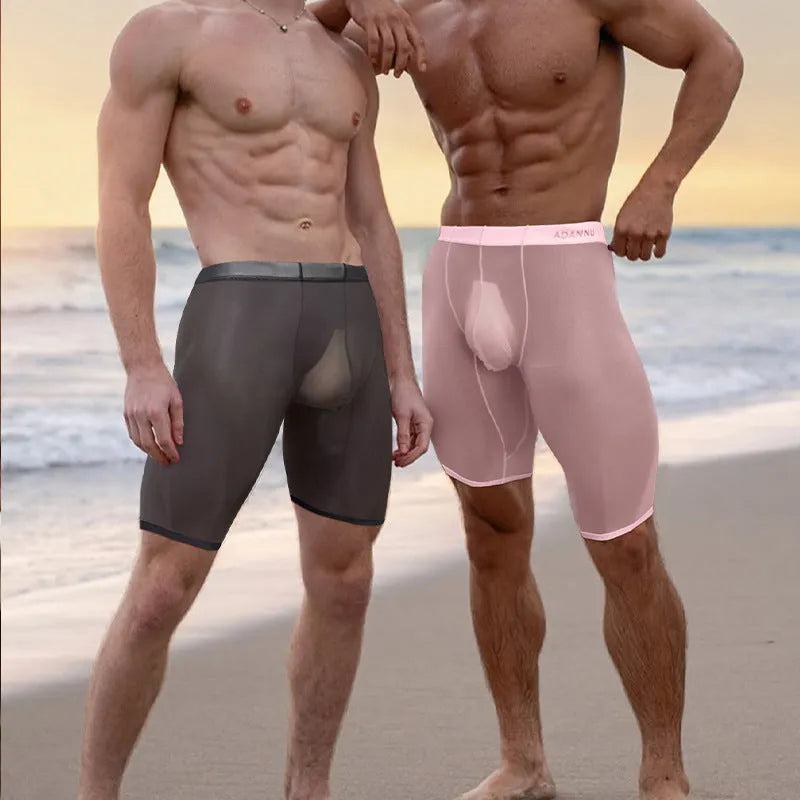 Men's solid-colour mesh shorts in black, shown laid flat to display seamless nylon knit fabric.