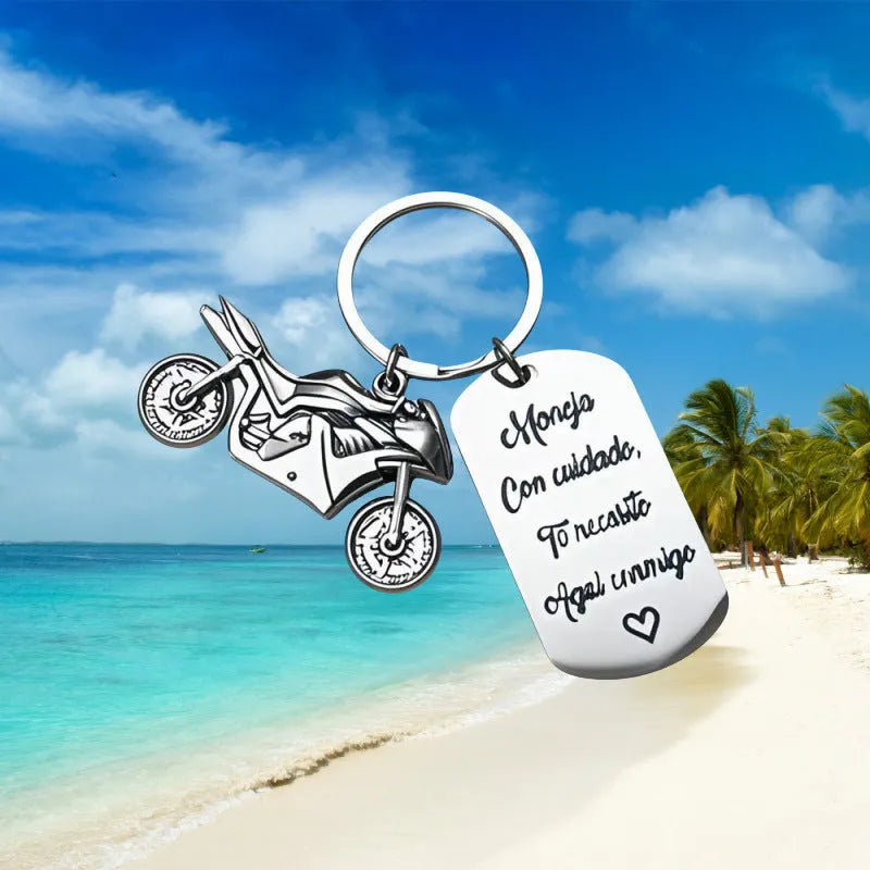 Stainless steel motorcycle keychain on a flannel bag.