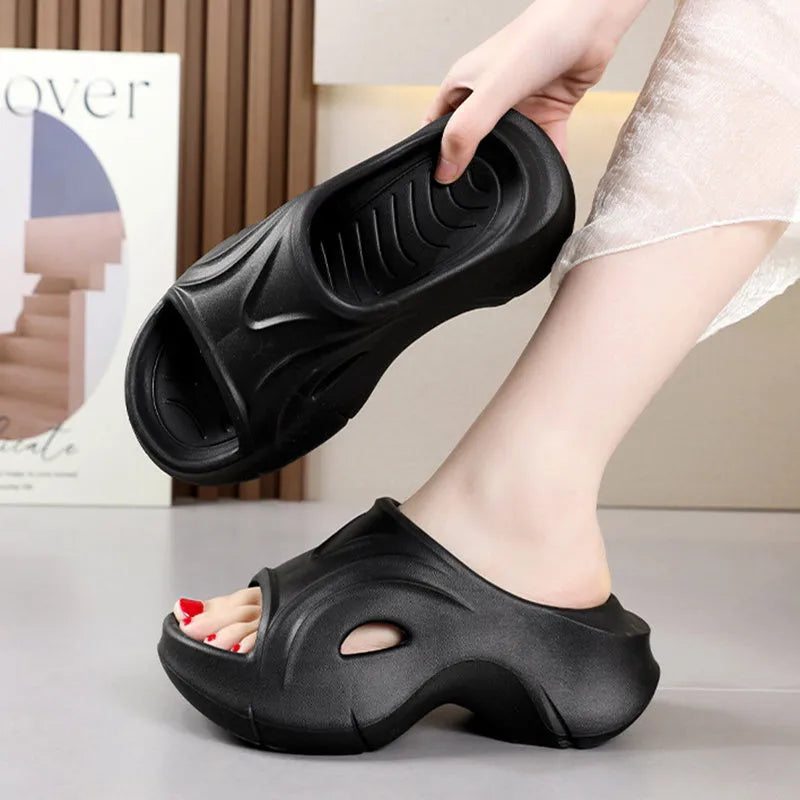 Women's thick-soled EVA slippers in rose red colour showing round toe design