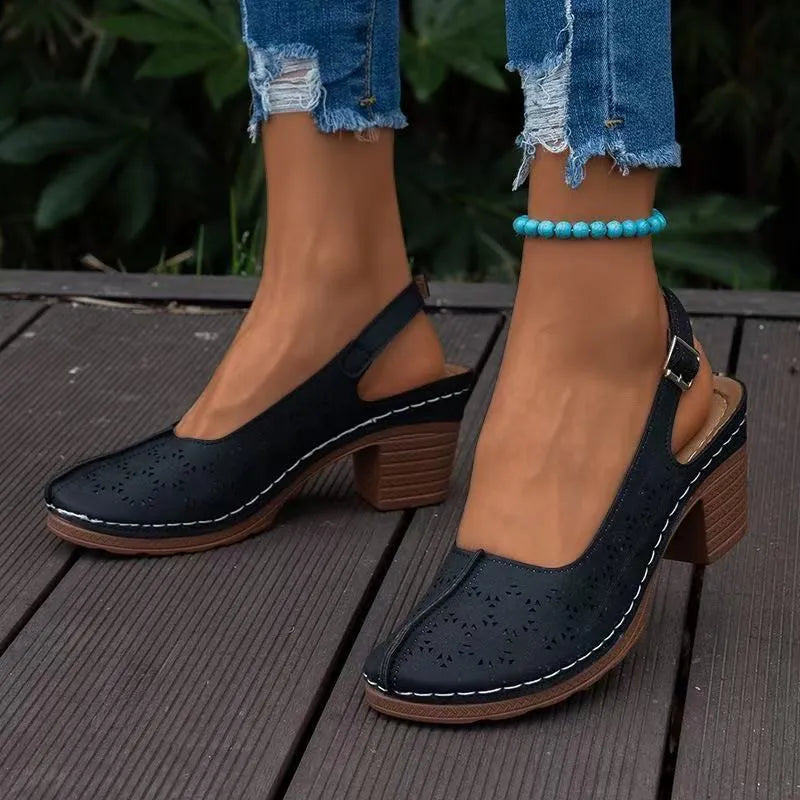 Women's closed toe wedge sandals in black with round toe design and wedge heel