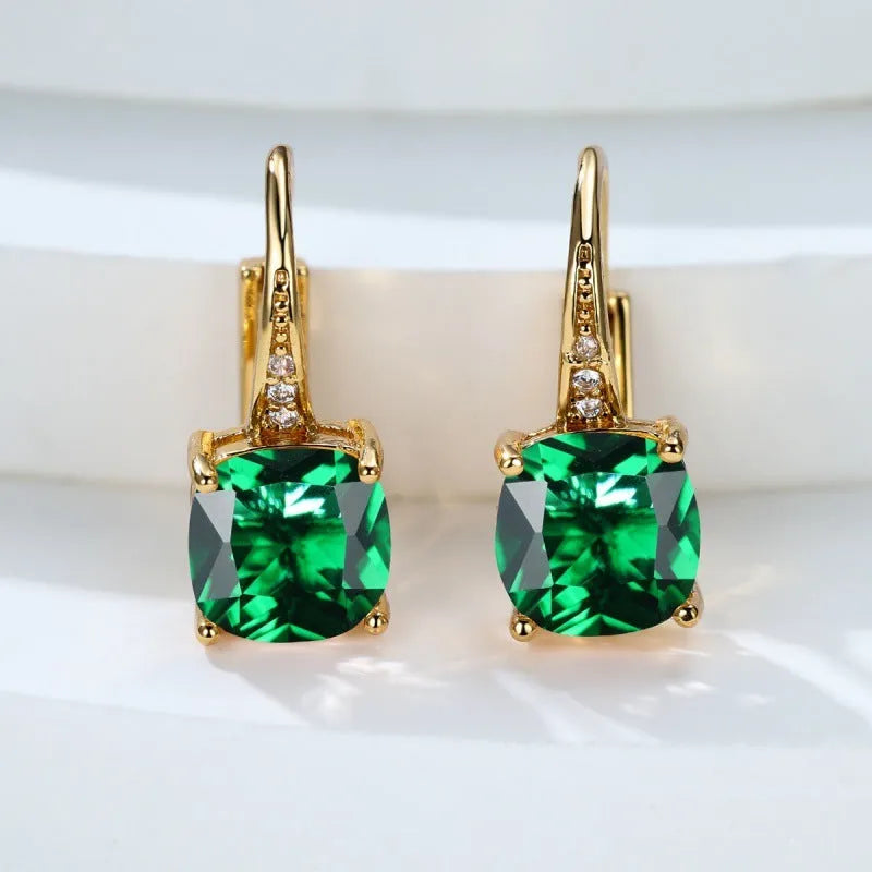 Square geometric ear clips with colourful moissanite stones in gold and silver electroplated finishes.
