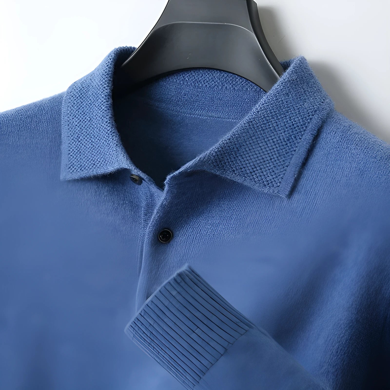 Men's grey wool blend pullover sweater with a polo collar and long sleeves laid flat