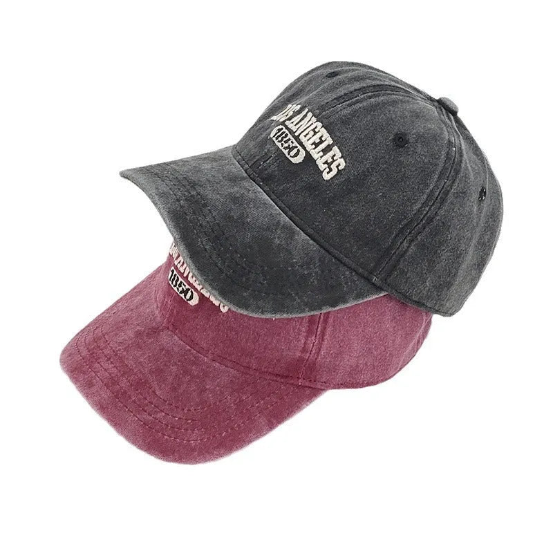 Retro adjustable peaked cap with distressed embroidery in conical crown design