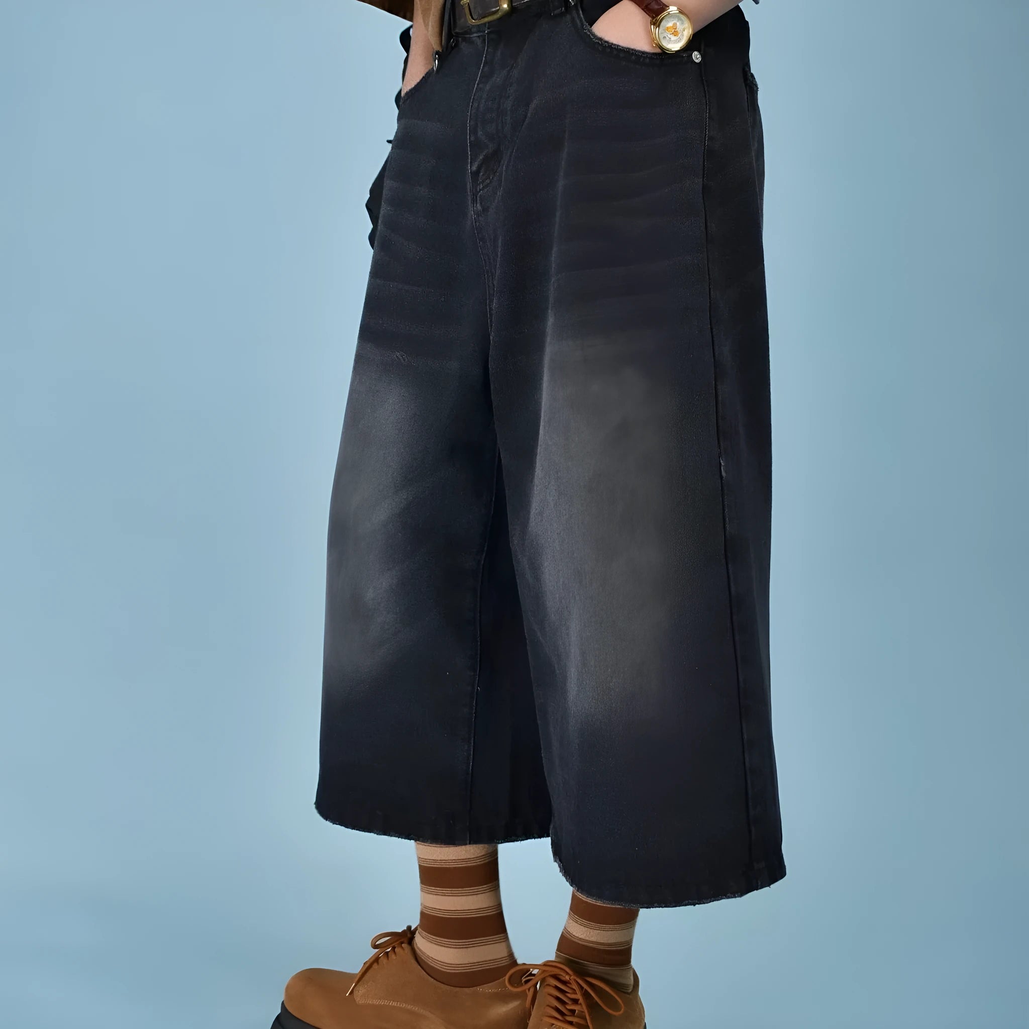 Men's loose-fit straight-leg denim shorts in blue, shown on a model for summer.