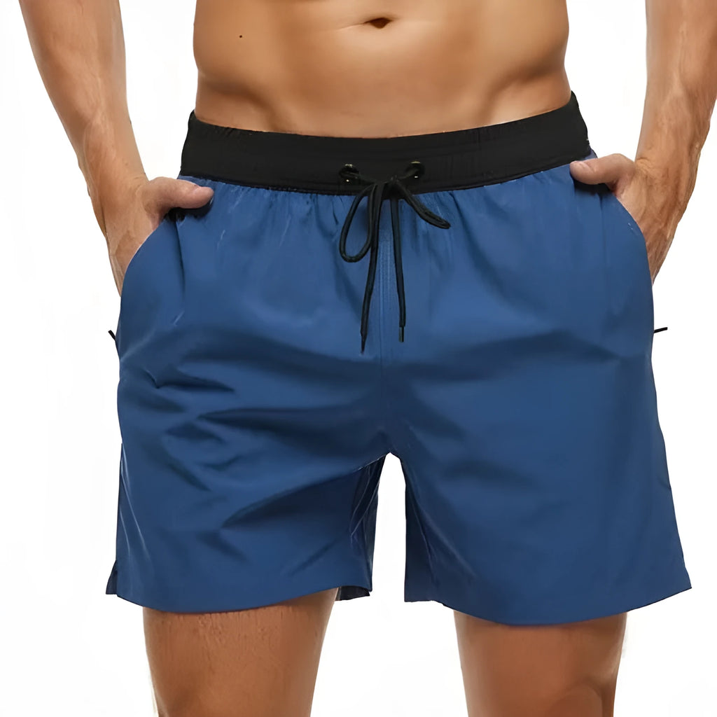 Men's blue training shorts with stitching waist detail and headband pocket for running and fitness