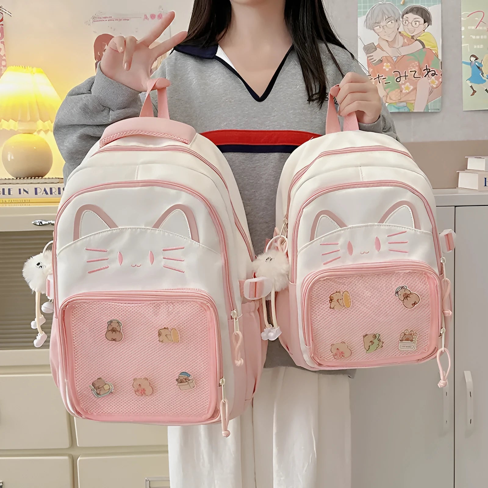 Korean cartoon large capacity nylon backpack in pink colour with badge pendant.
