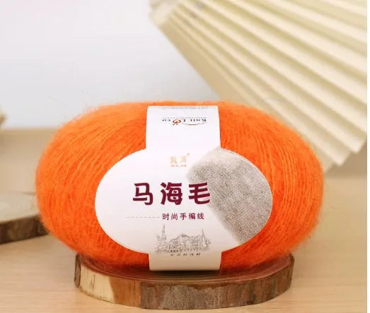 Single ball of mohair yarn in various colours for hand-woven DIY scarf knitting projects