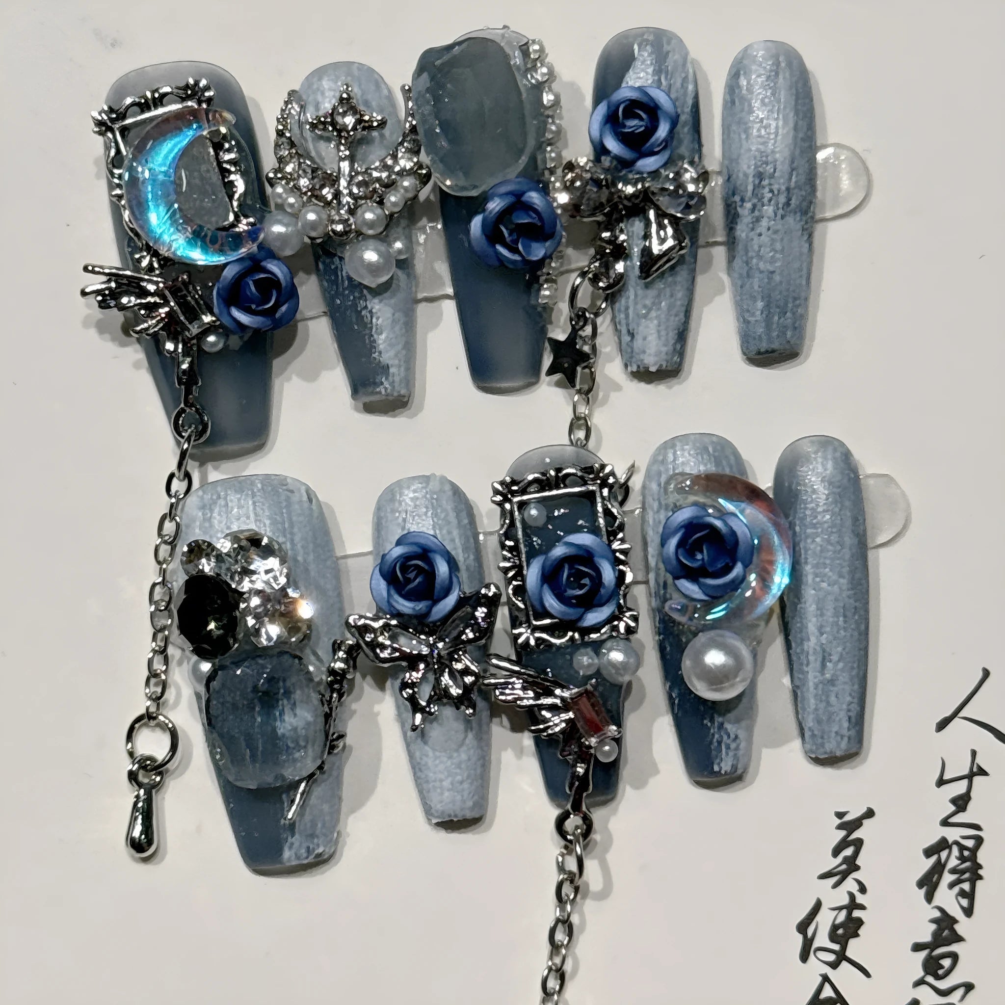 Reusable blue floral press-on nails with rose pattern in sizes XS, S, M, L