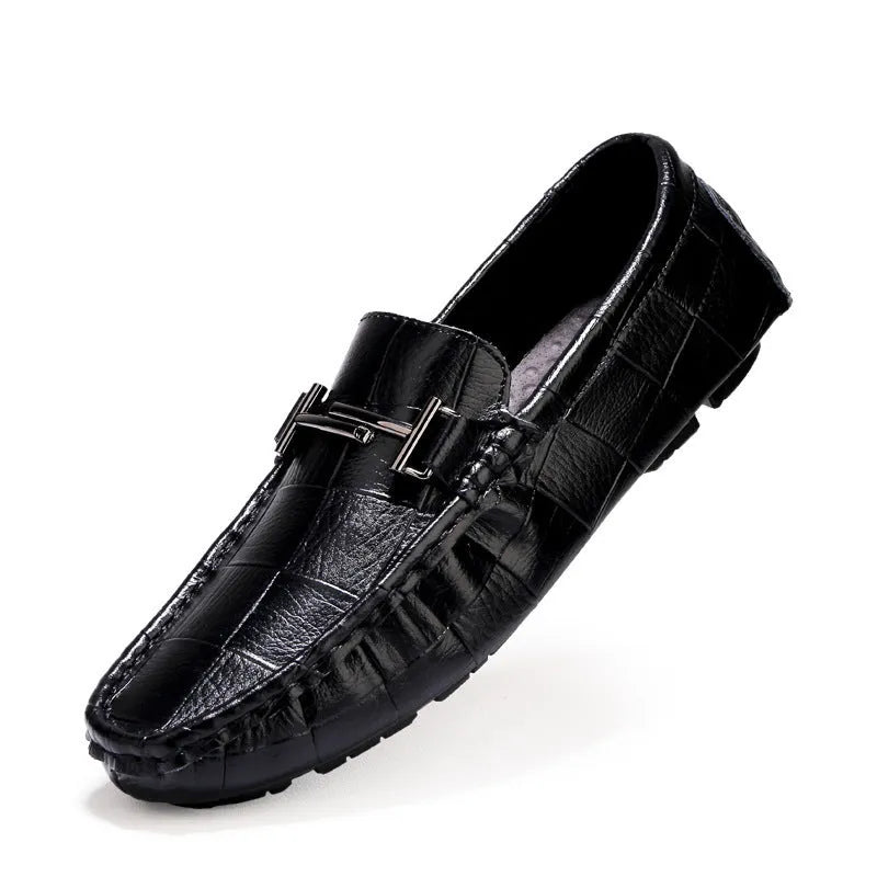 Men's black leather casual peas shoes with a belt buckle and flat rubber sole.