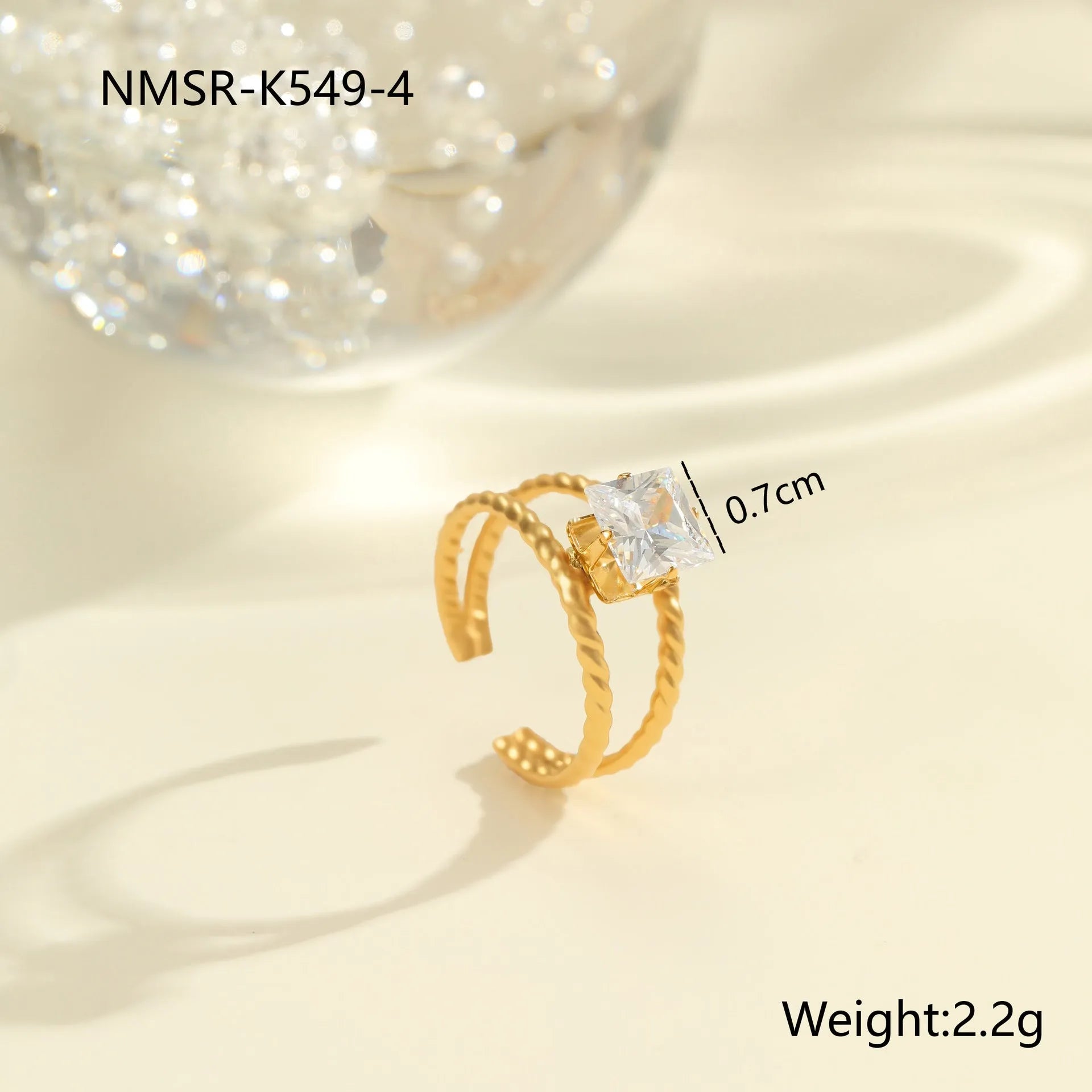 Gold electroplated stainless steel ring with zircon geometric design and open mouth adjustable fit