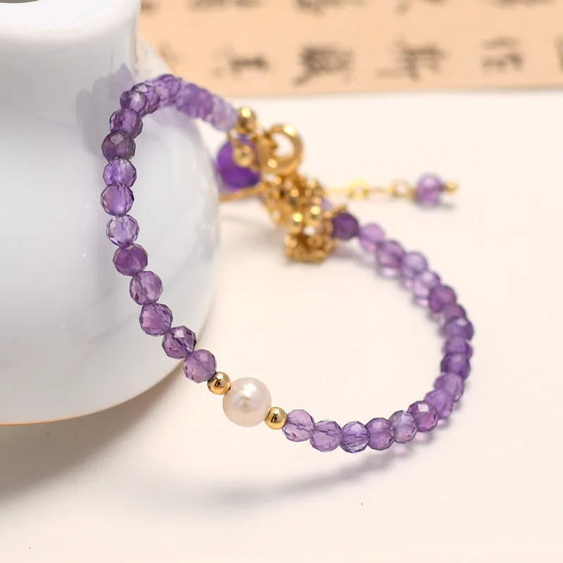 Chinese style women's amethyst crystal bracelet with electroplated diamond-shaped beads.
