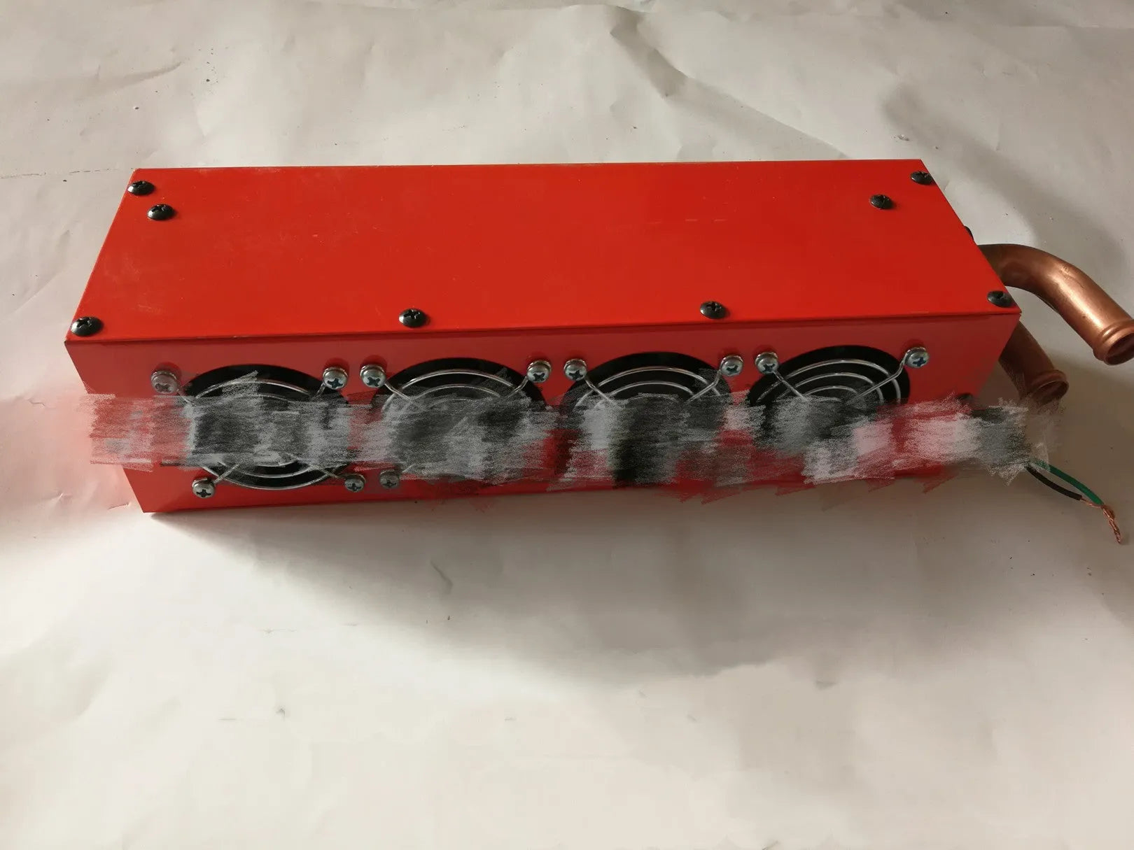 Metal car heater unit with copper pipe radiator for 12V and 24V vehicle installation.