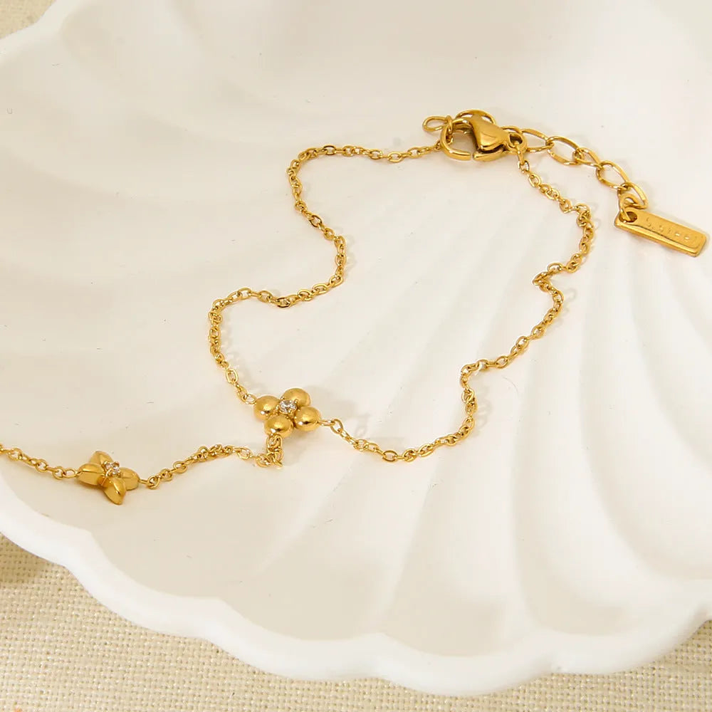 Gold stainless steel bracelet with geometric flower and octagonal star design