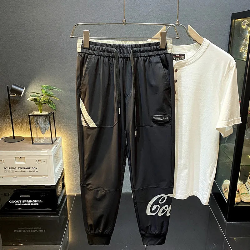 Black men's ultra-thin cotton cropped trousers with elasticated ankle banding.