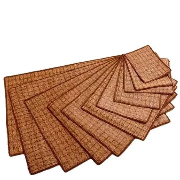 Brown woven rattan cooling mat for dogs on a wooden floor.