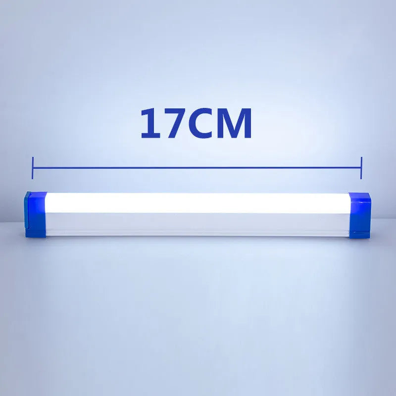 Blue and purple rechargeable LED tube light with USB cable on a dark background.