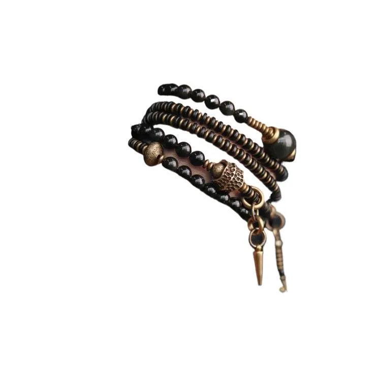 Black geometric beaded bracelet with colourful layered retro design.