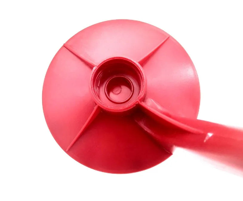 Red plastic soda dispenser attached to inverted 2-litre bottle for push-button drink serving