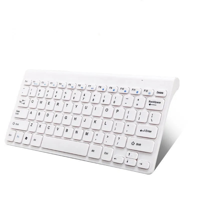 Black wireless keyboard and mouse set with 4G receiver on wooden desk
