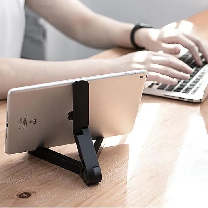 Black foldable tablet holder showing unfolded stand position with device placement area