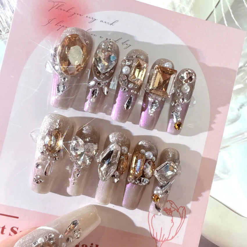 Rhinestone-decorated press-on false nails displayed on card paper packaging with size S classification
