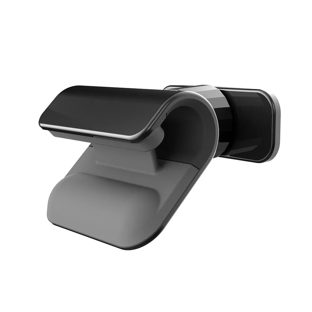 Black gravity car phone holder with 360-degree rotating head mounted on a car air vent.