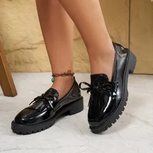 Women's black and brown bow loafers in artificial PU material with slip-on design for spring and autumn wear