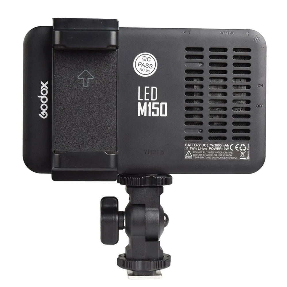 Shenniu M150 ultra-thin silver LED video light mounted on a mobile phone with adjustable brightness.