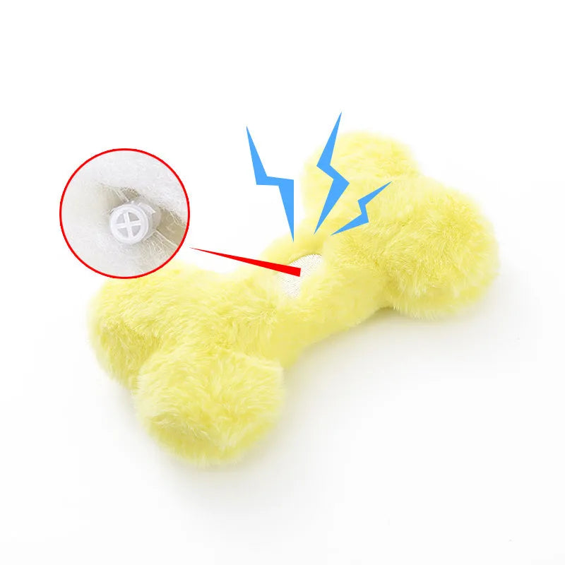 Cute love bone shaped plush dog toy in blue, pink, and yellow colours for interactive chewing play.