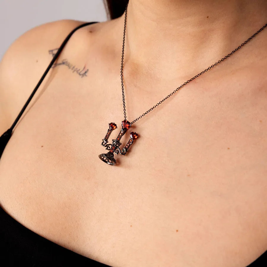 Women's vintage-style necklace with a detailed hollow candlestick pendant and cross chain in zinc alloy.