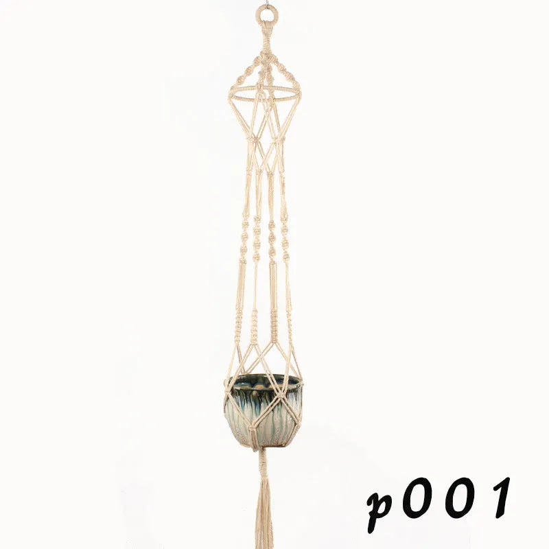 Woven cotton rope plant holder in a desktop style with greenery inside.