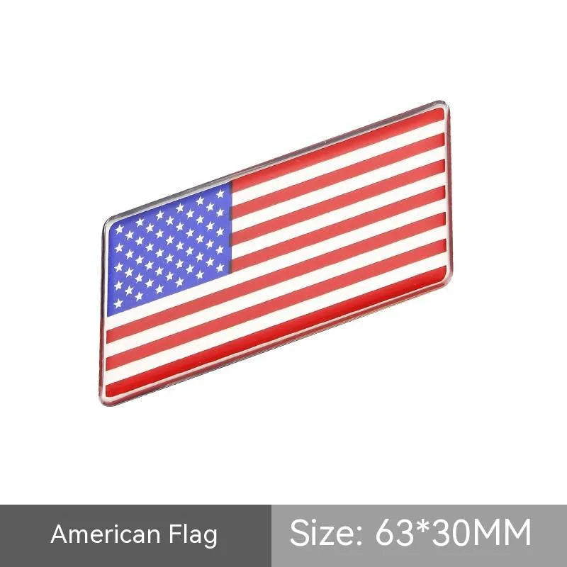 Aluminium parallelogram car sticker with national flag design measuring 6.3 by 3 cm