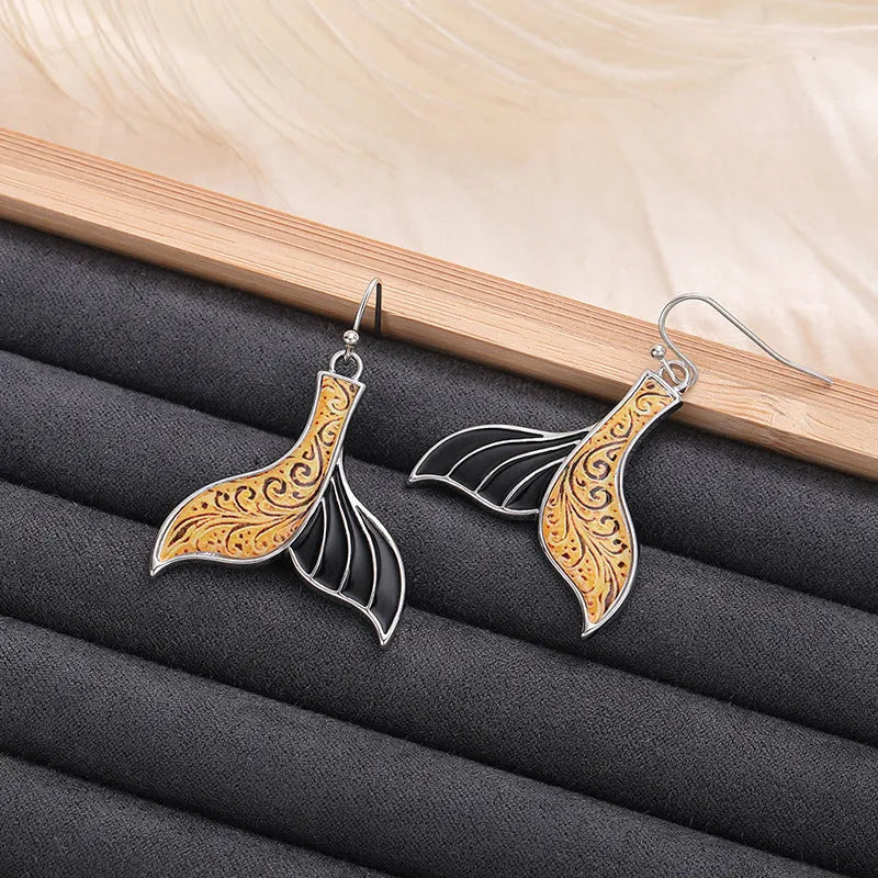 Women's fishtail earrings with retro whale design in white gold colour alloy metal