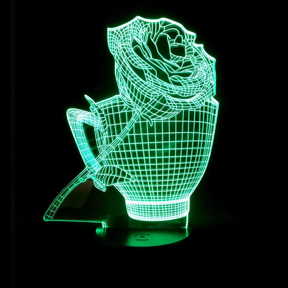 3D rose design acrylic night light with ABS base on a table, showing multi-coloured LED illumination.