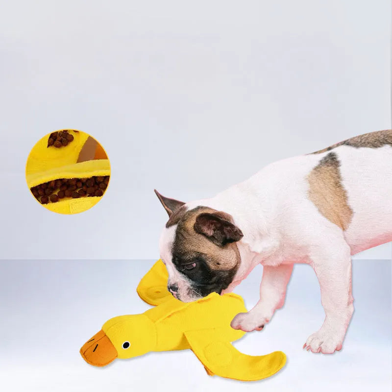 Yellow plush duck dog toy with treat holes and sound module for training and chewing