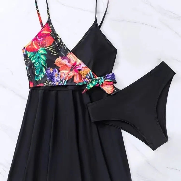 Black women's high-waist bikini briefs with a printed split design on a mannequin.
