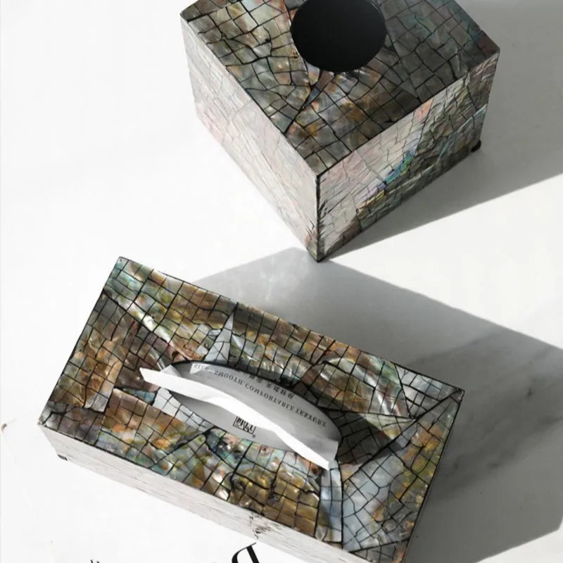 Natural shell rectangular and square storage box for tissue box organisation on a coffee table.