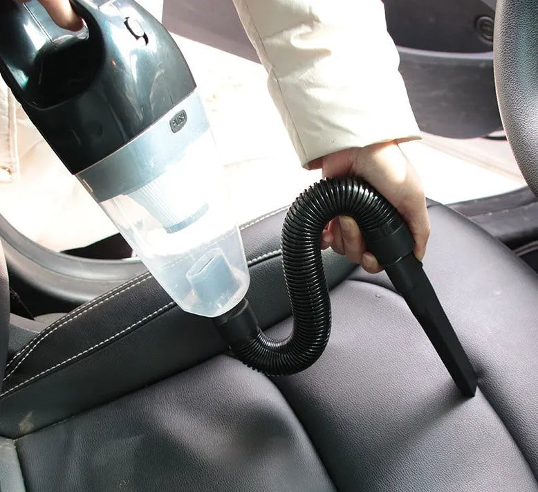 Orange, black, and blue 12V portable handheld car vacuum cleaner with power cord.