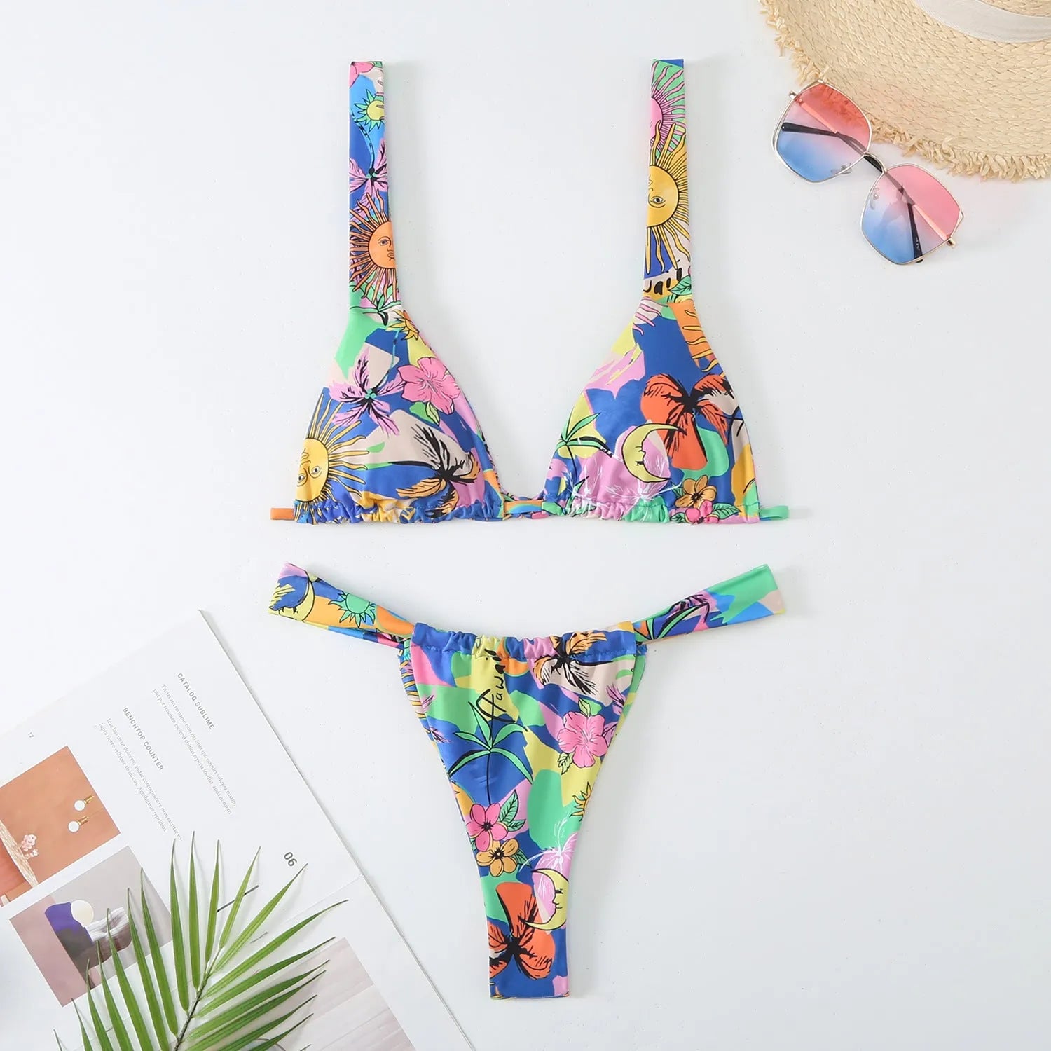 Women's floral printed bikini swimsuit two-piece set in blue on a mannequin.