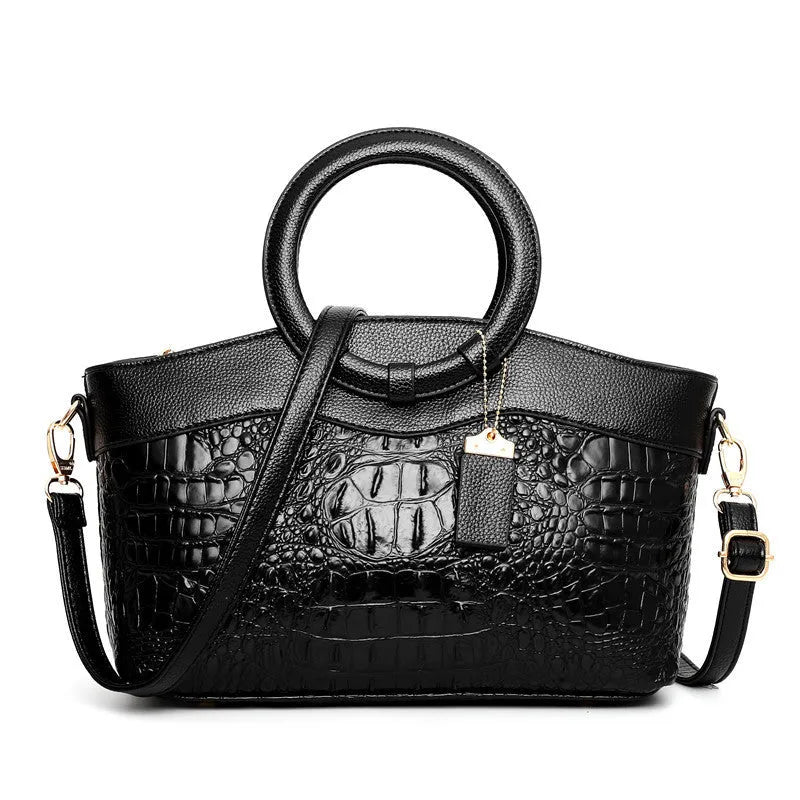 Fabric ladies handbag showing multiple compartments including phone and ID sections