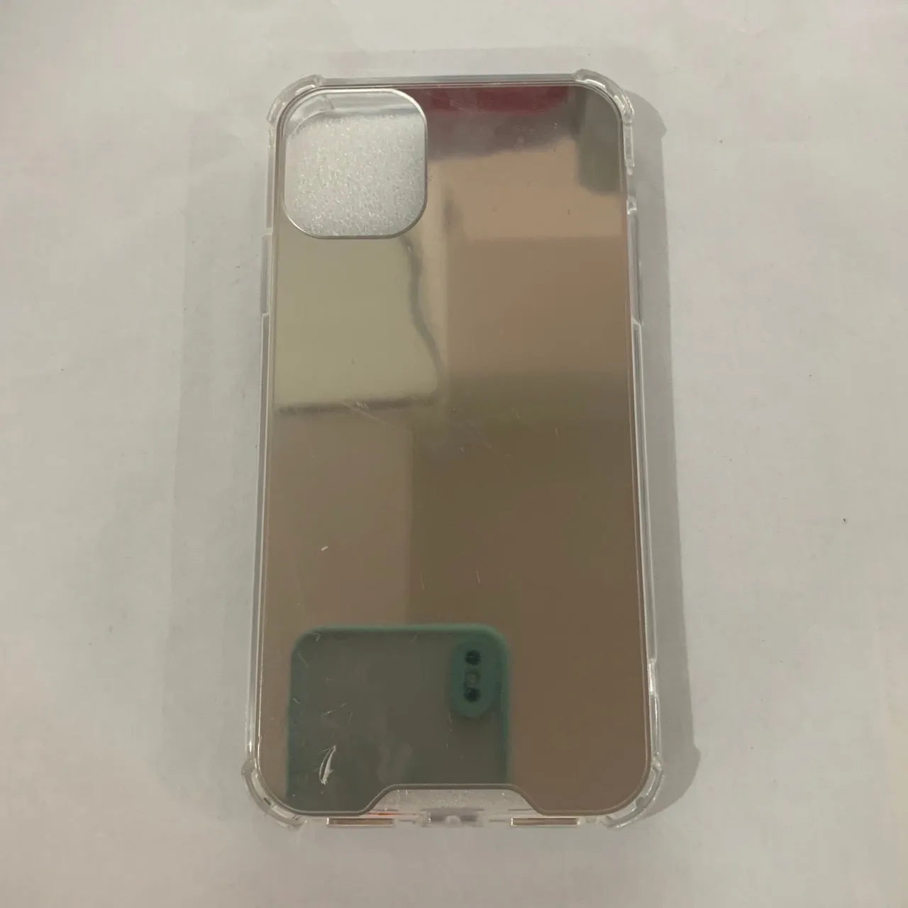 Mirror finish protective TPU case for iPhone shown in various colours.