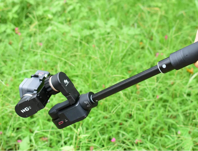 Black retractable hand-held stabilizer selfie stick extended for smartphone photography