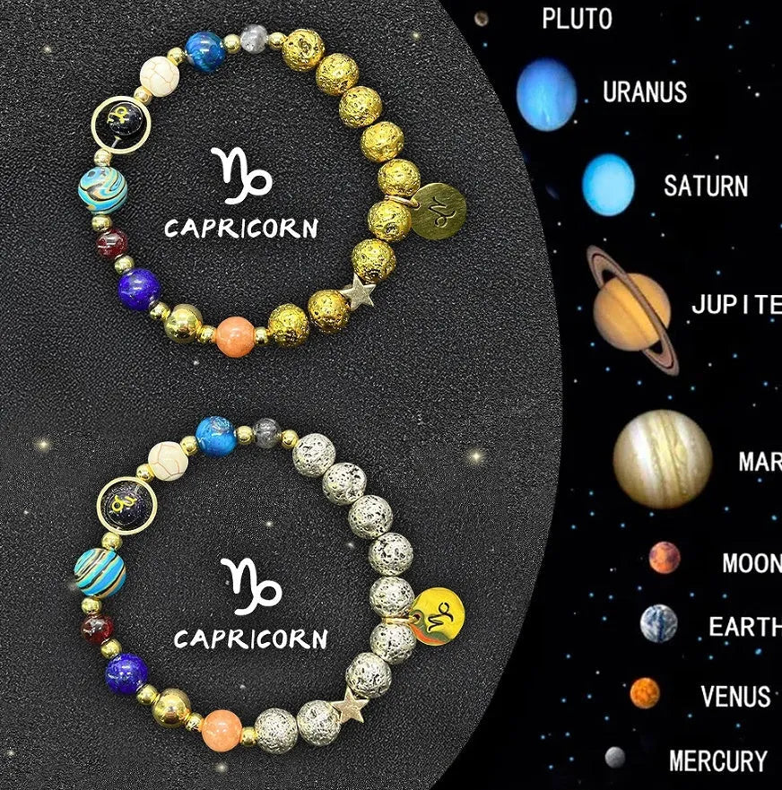 Two natural stone beaded bracelets showing zodiac sign charms on a wooden surface.
