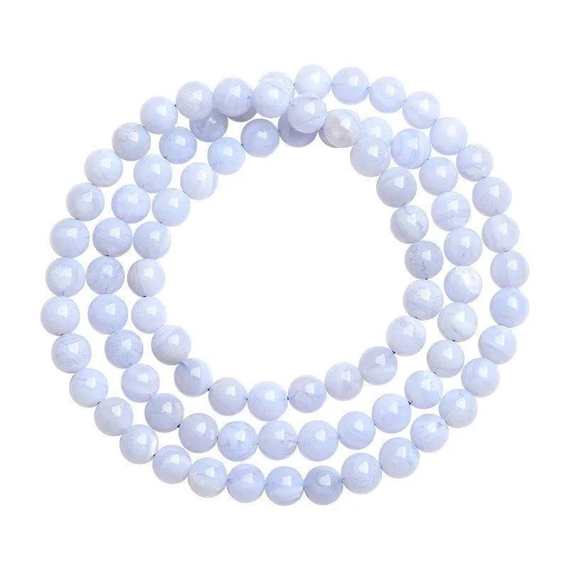 Blue agate bracelet with natural striped beads and Ruyi design elements