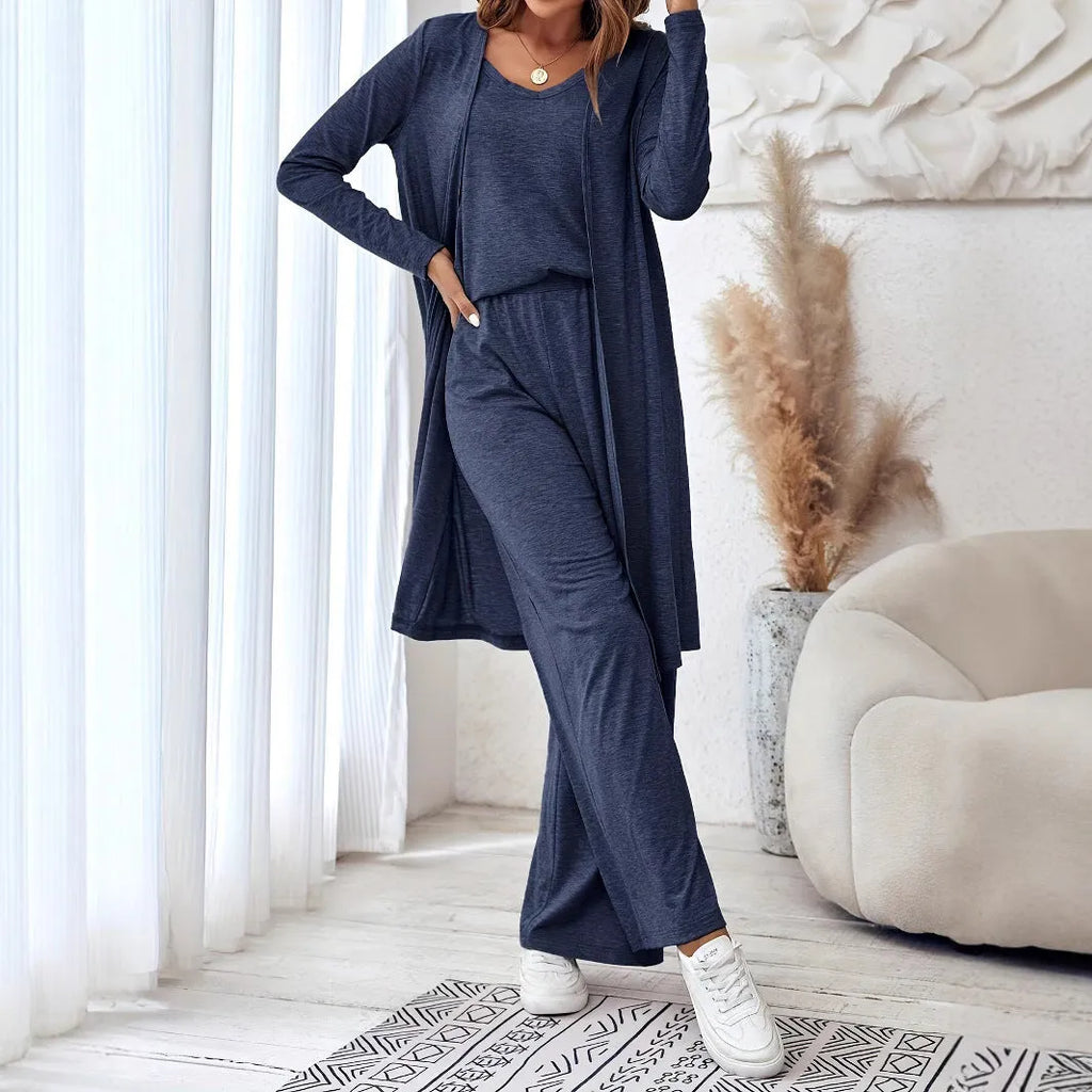 Blue three-piece women's suit set with long sleeve top and trousers in solid color