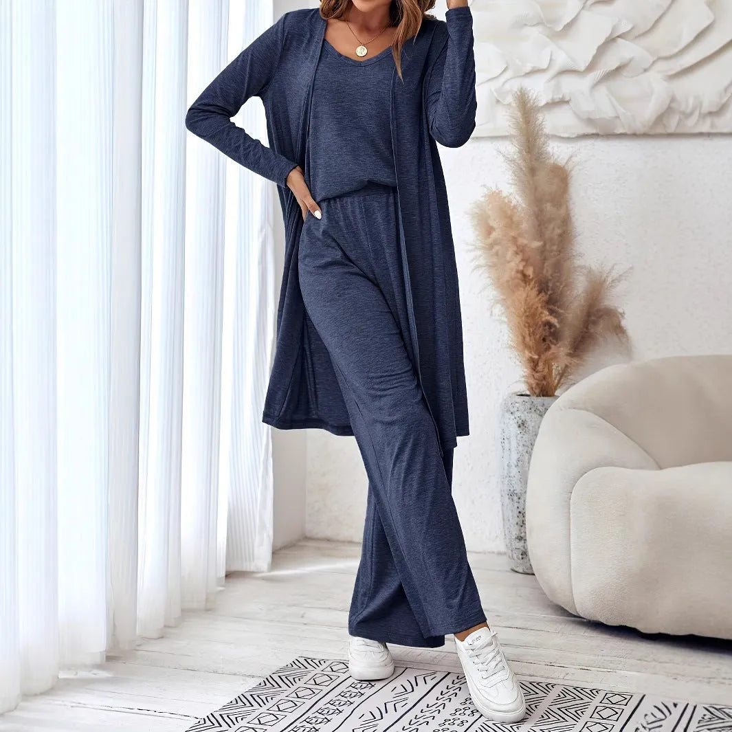 Blue three-piece women's suit set with long sleeve top and trousers in solid color